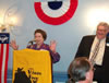 Maggie leads the attendees in singing Happy Birthday to Rex Stout