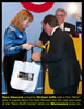 Mary Glascock give Michael Jaffee Wolfe Pack gifts